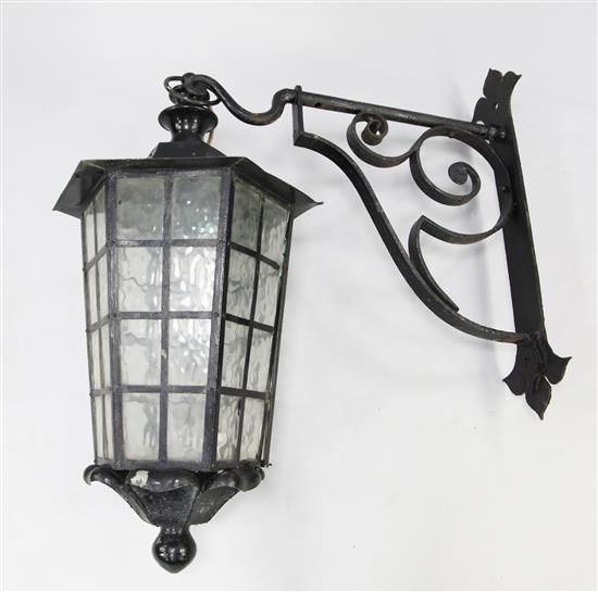 A large black painted hexagonal tapering lantern, drop 3ft 4in. incl. hanging loop